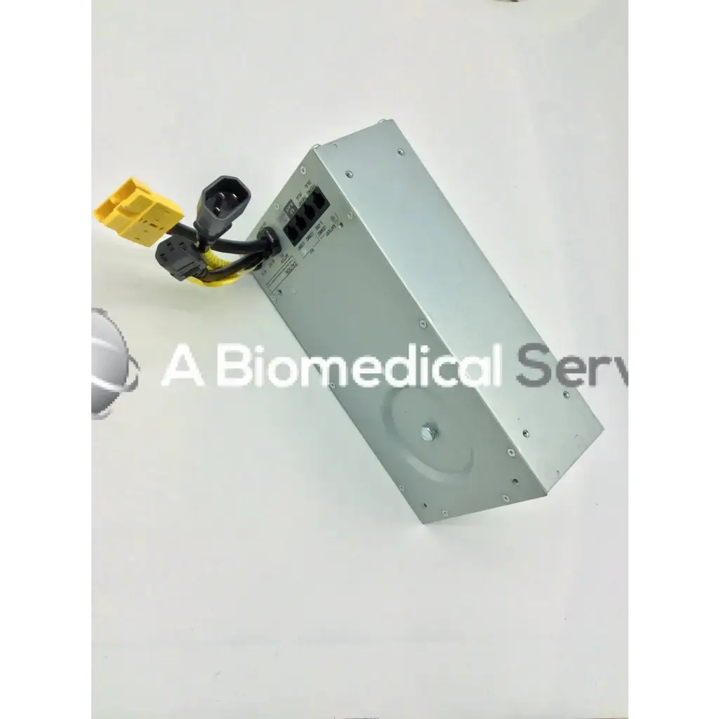 Silver metallic rectangular tripp lite hc150sl medical cart power supply unit with black and yellow cables attached