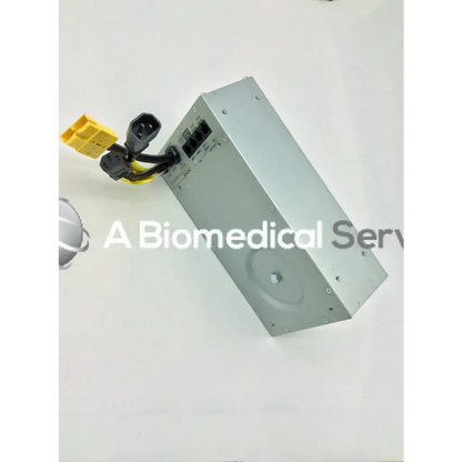 Silver metallic rectangular tripp lite hc150sl medical cart power supply unit with black and yellow cables attached