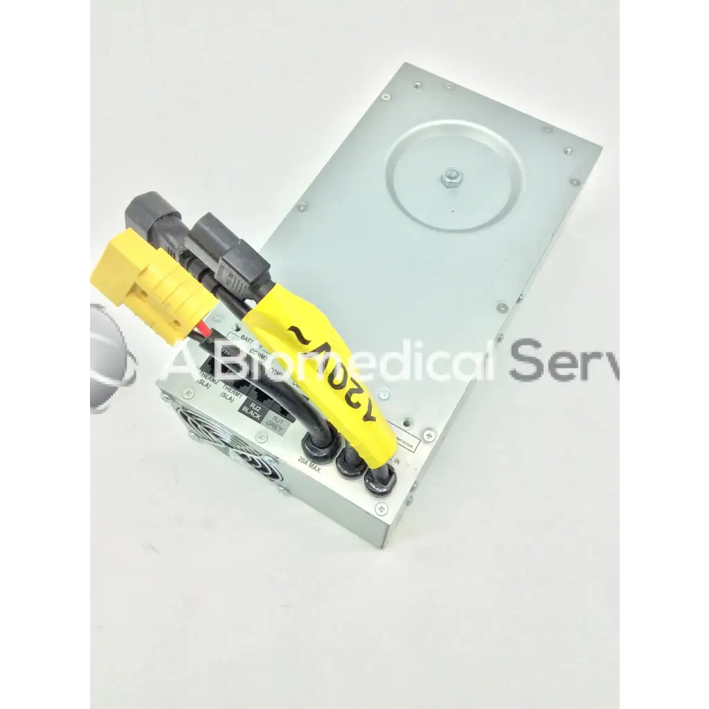 Silver metallic medical-grade tripp lite hc150sl power supply with yellow and black connectors for medical cart use