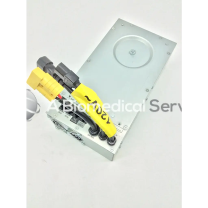 Silver metallic medical-grade tripp lite hc150sl power supply with yellow and black connectors for medical cart use