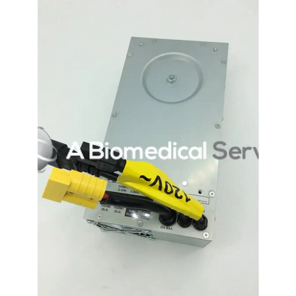 Silver metallic rectangular tripp lite hc150sl medical cart power supply unit with black and yellow connectors 150w 120v