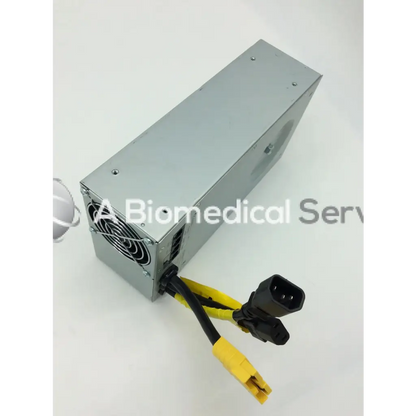 Silver metallic rectangular tripp lite hc150sl medical cart power supply 150w 120v with black and yellow cables and connectors