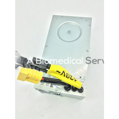 Silver metallic tripp lite hc150sl medical cart power supply 150w 120v with black and yellow connectors shown from back