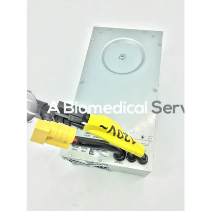 Silver metallic tripp lite hc150sl medical cart power supply unit with black and yellow connectors for 150w 120v use
