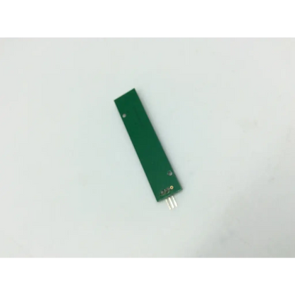 Green rectangular circuit board with three silver pins for tnm1r0014-a1-e controller tnm1r0014-a1-e use