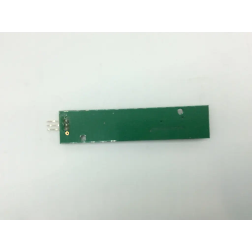 Green rectangular circuit board with three metallic pins and a gold component in tnm1r0014-a1-e controller product