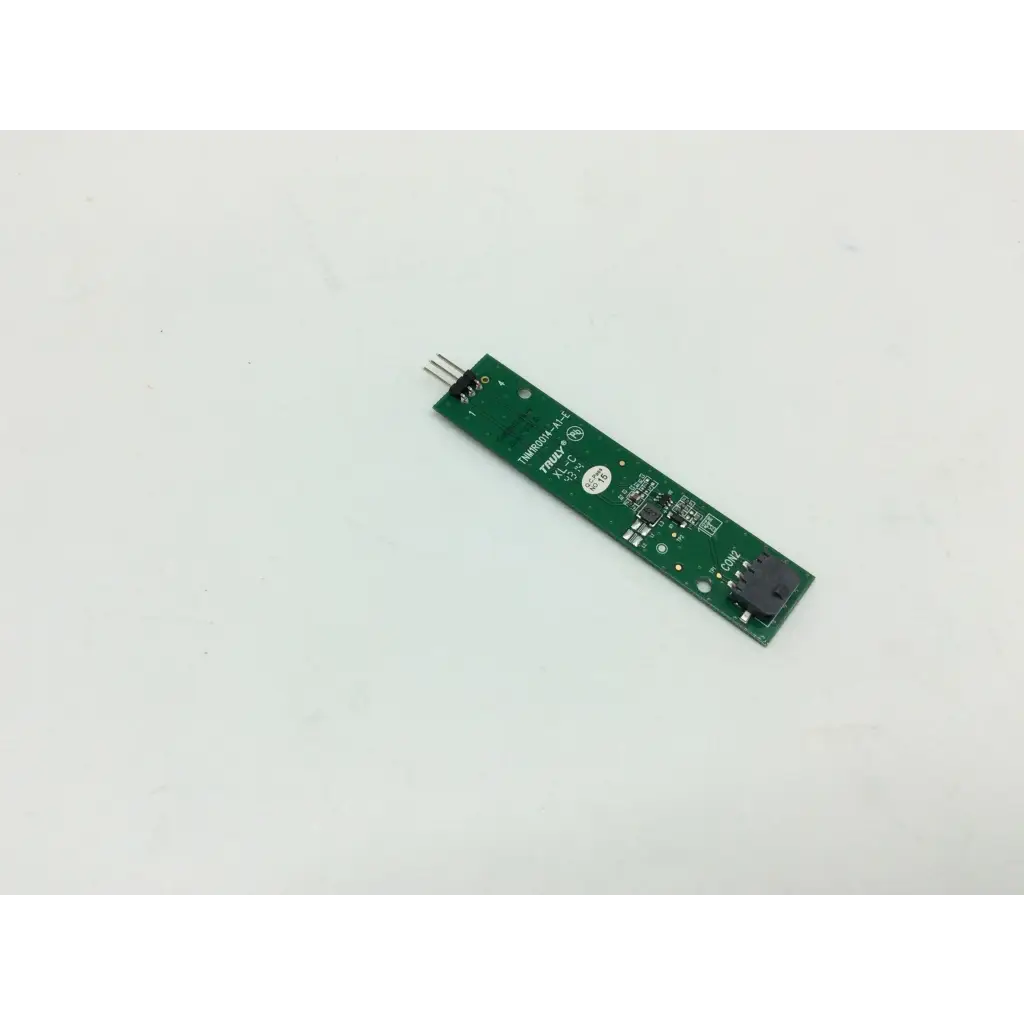 Green rectangular circuit board with black components and silver pins of tnm1r0014-a1-e controller product