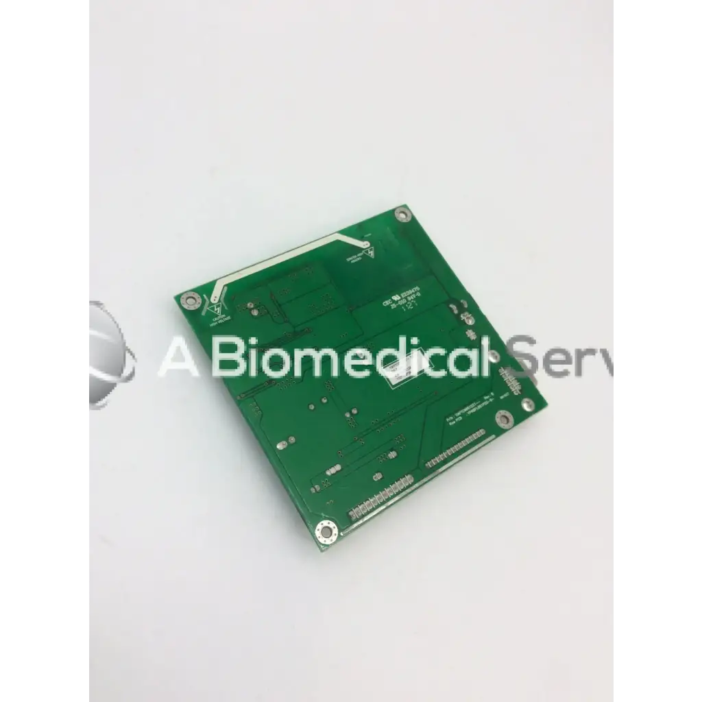 Green rectangular tyco electronics e385256 rev circuit board with silver solder points and component markings