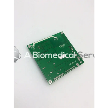 Green rectangular tyco electronics e385256 rev circuit board with silver solder points and component markings