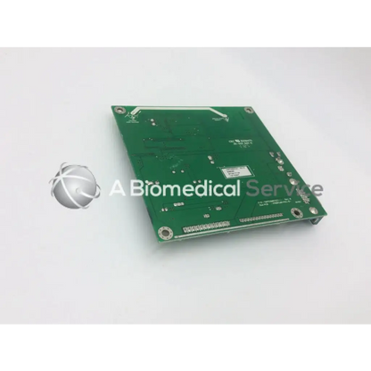 Green rectangular circuit board with silver solder points and component markings tyco electronics e385256 rev b board