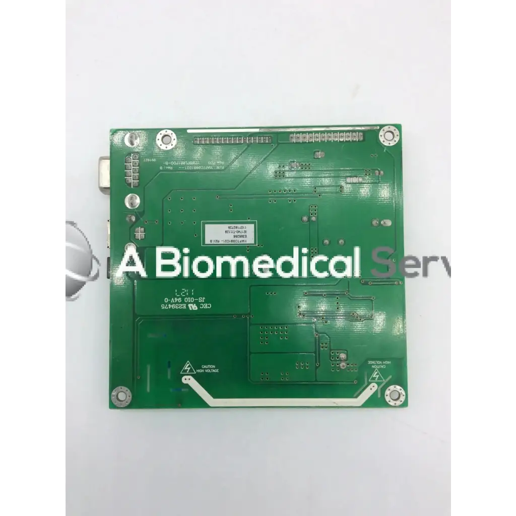 Green rectangular circuit board with silver soldered components and white labeling tyco electronics e385256 rev b board