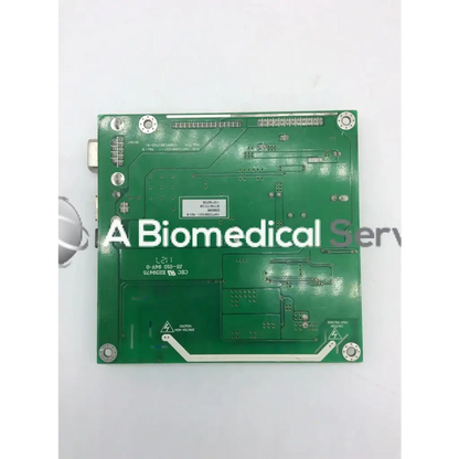 Green rectangular circuit board with silver soldered components and white labeling tyco electronics e385256 rev b board