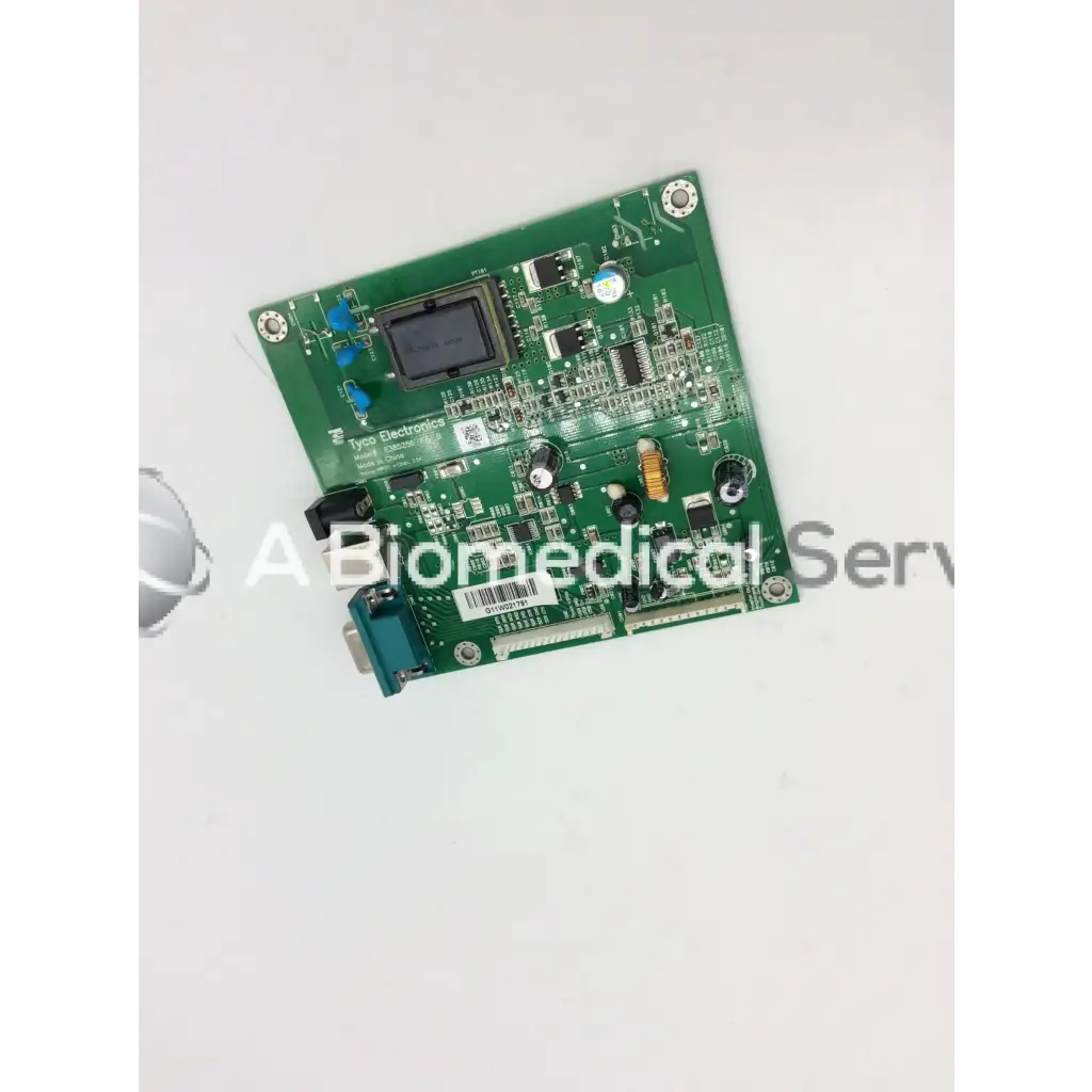 Green rectangular tyco electronics e385256 rev circuit board with electronic components and black display screen