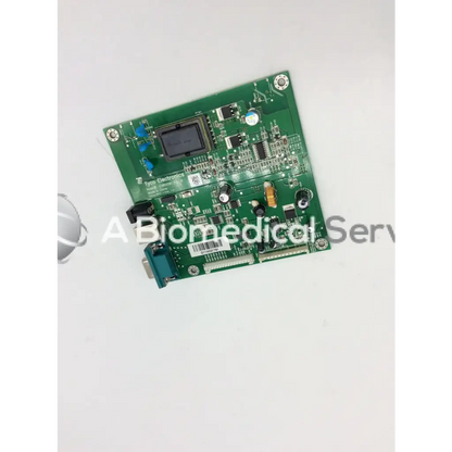 Green rectangular tyco electronics e385256 rev circuit board with electronic components and black display screen