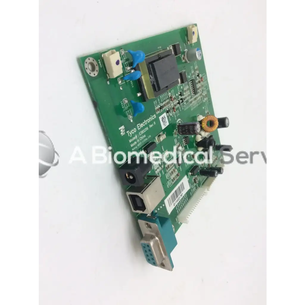 Green printed circuit board labeled tyco electronics model 128503b from tyco electronics e385256 rev b board