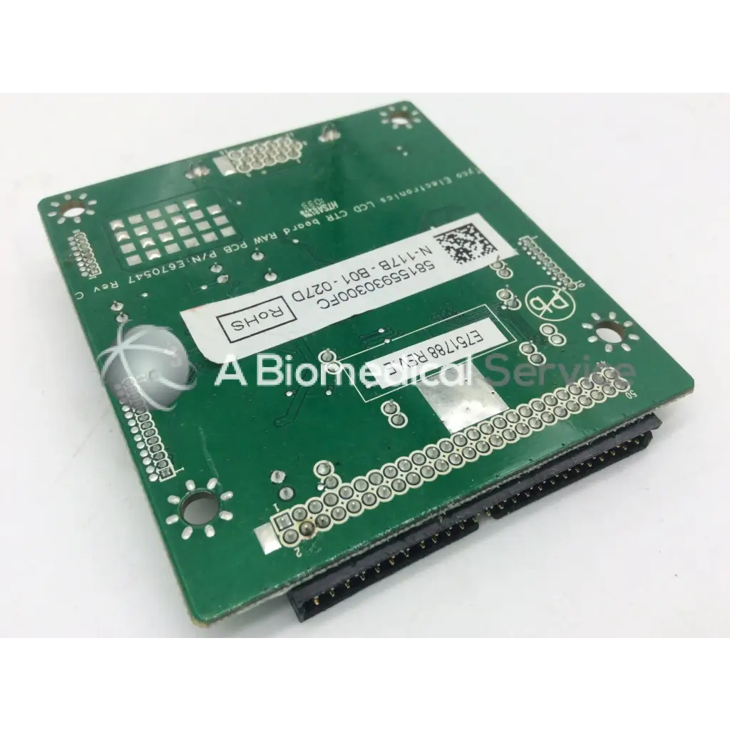 Green rectangular lcd controller board with silver solder points and black pins tyco electronics e670547 rev c