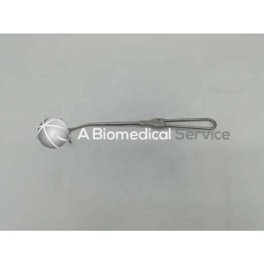 Silver mueller nl1020 cushing retractor with spherical cross-hatched head and slender handle ending in open loop