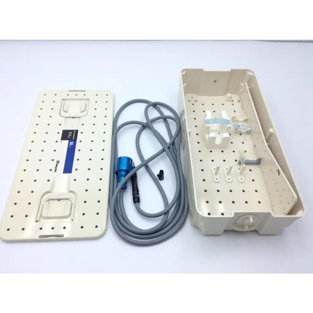Beige plastic surgical instrument tray with perforated surface and blue cable for valleylab cusa excel handpiece