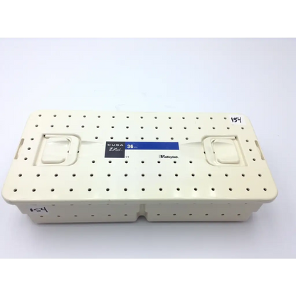 Cream-colored plastic surgical instrument tray with perforated surface and handles for valleylab cusa excel handpiece