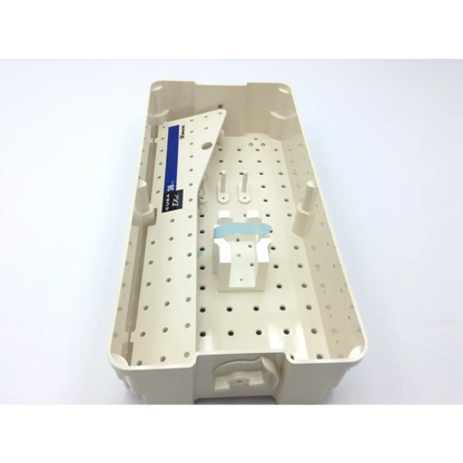 Beige plastic dental instrument tray with perforated surface and labeled compartment for valleylab cusa excel handpiece