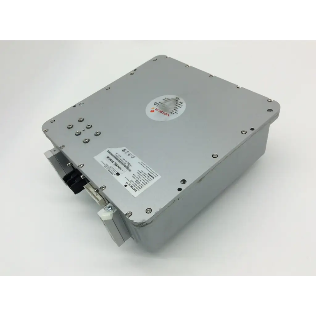 Gray metallic industrial box with circular sticker and label on surface of vatech x-ray generator hdg-07b10t2