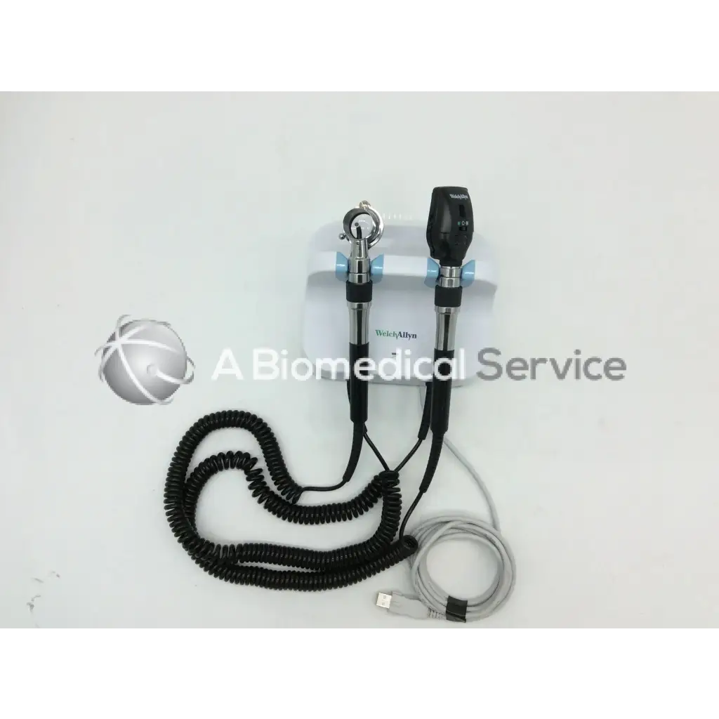 Black and silver welch allyn green series otoscope with coiled black cable and usb charging cord for wall transformer use