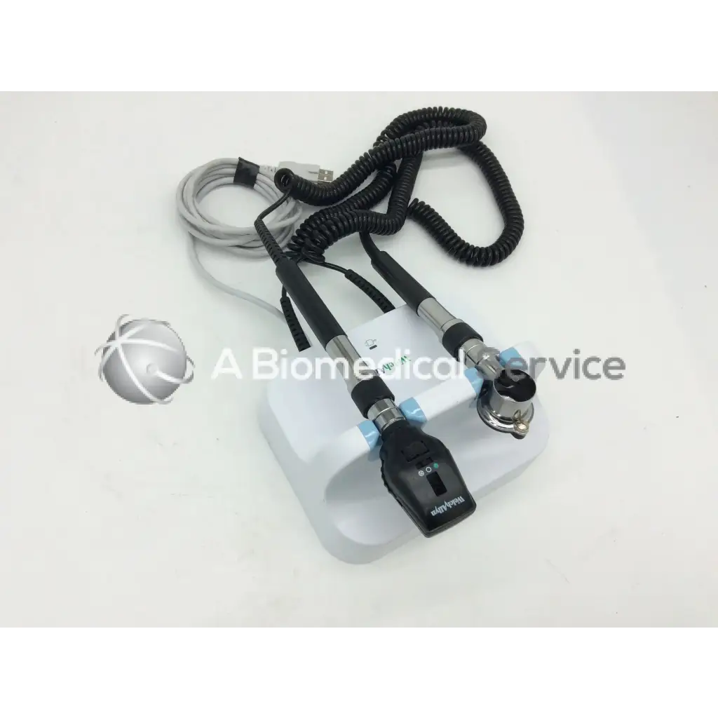 Welch allyn green series gs 777 wall transformer otoscope with white and black design and coiled cables on a white base