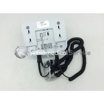 White plastic wall-mounted welch allyn green series wall transformer opthalmoscope with coiled black and gray cables and spherical sensor