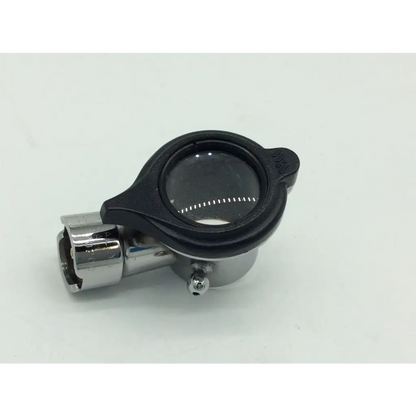 Black-rimmed magnifying glass with chrome frame and adjustable focus on welch allyn hillrom hal pneumatic otoscope