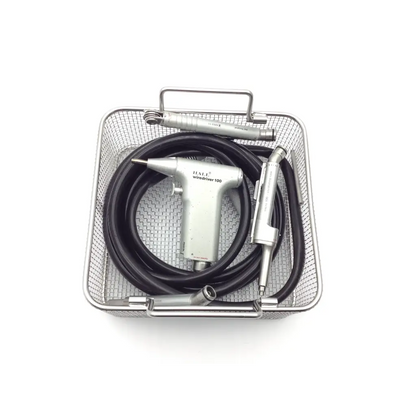 Silver hall wiredriver 100 dental handpiece with black pneumatic hose orthopedic driver and metallic attachments in mesh basket