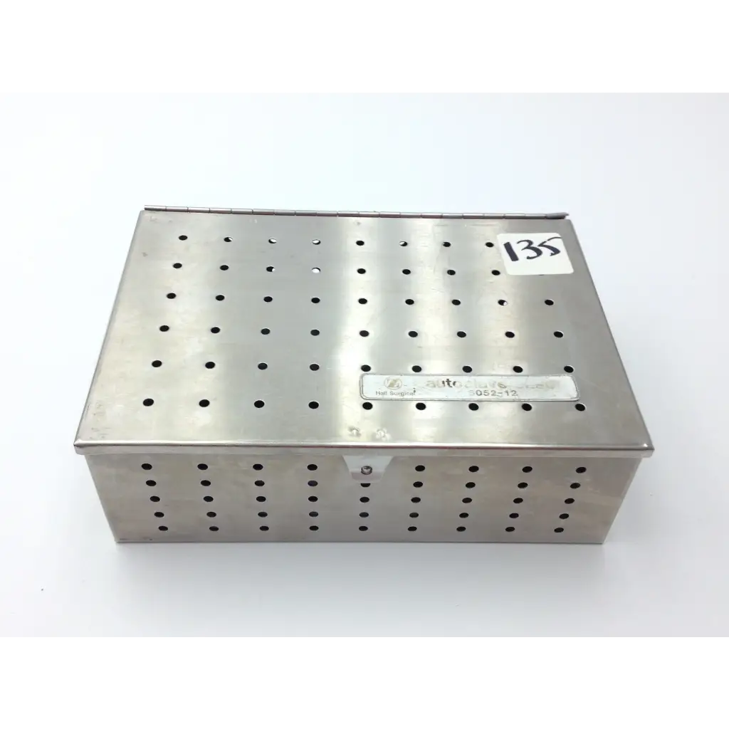 Stainless steel perforated dental instrument box labeled itc for zimmer hall surgical micro 100 set case