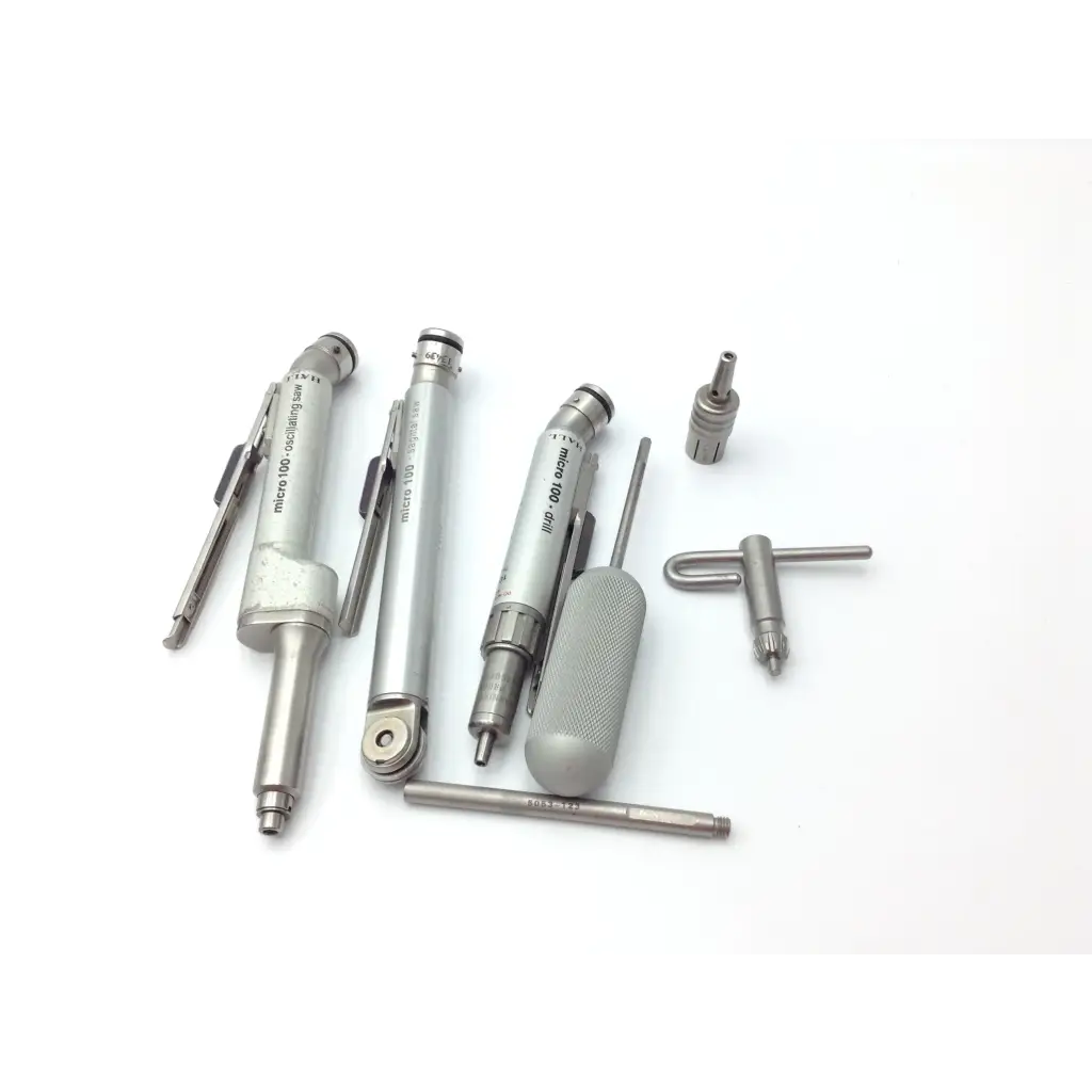 Set of silver metallic precision engineering tools with textured grips including micrometers in zimmer hall surgical micro 100 set