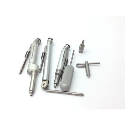 Set of silver metallic precision engineering tools with textured grips including micrometers in zimmer hall surgical micro 100 set
