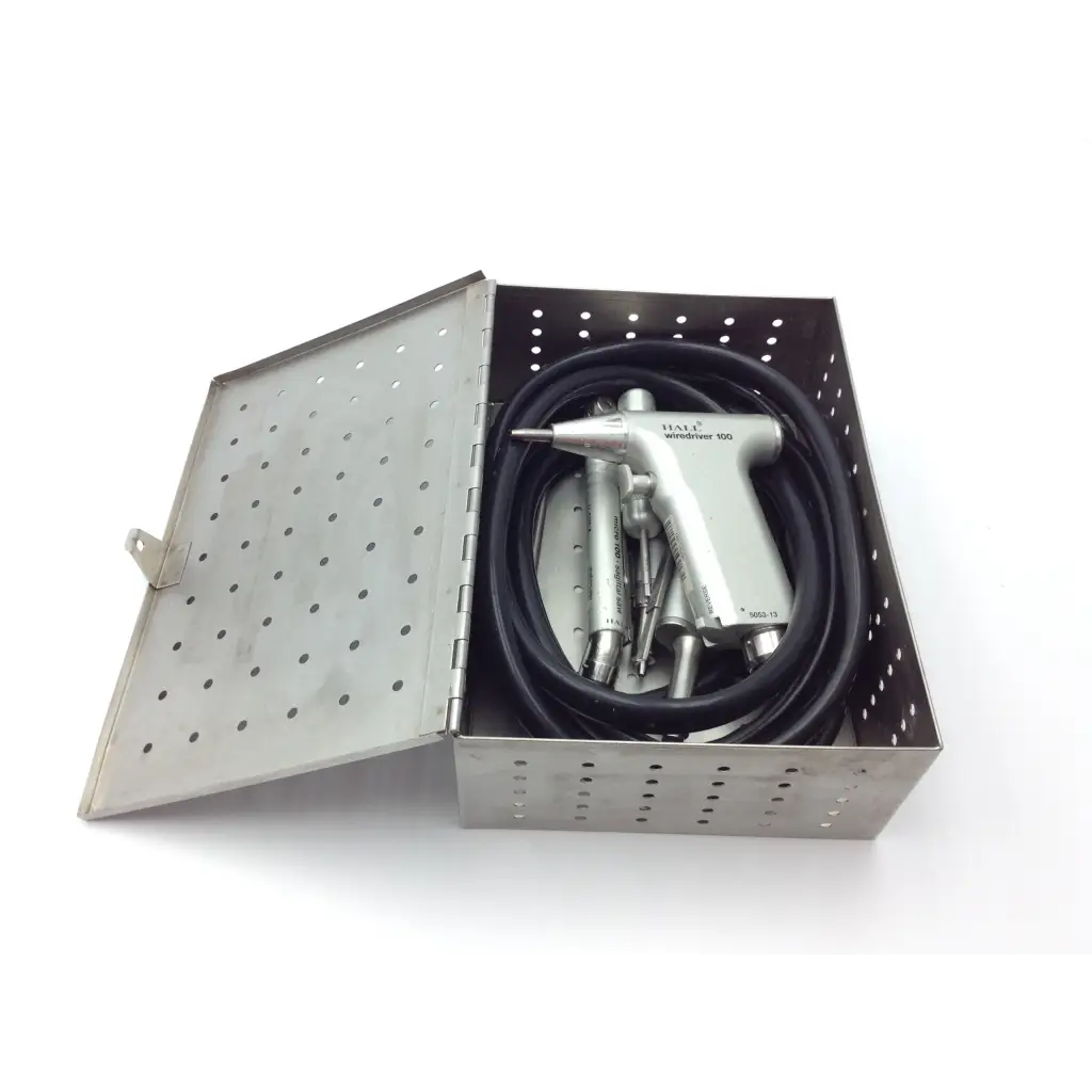 Silver hale air-driven 900 dental handpiece with black coiled hose and bits in metal case for zimmer hall surgical wire use