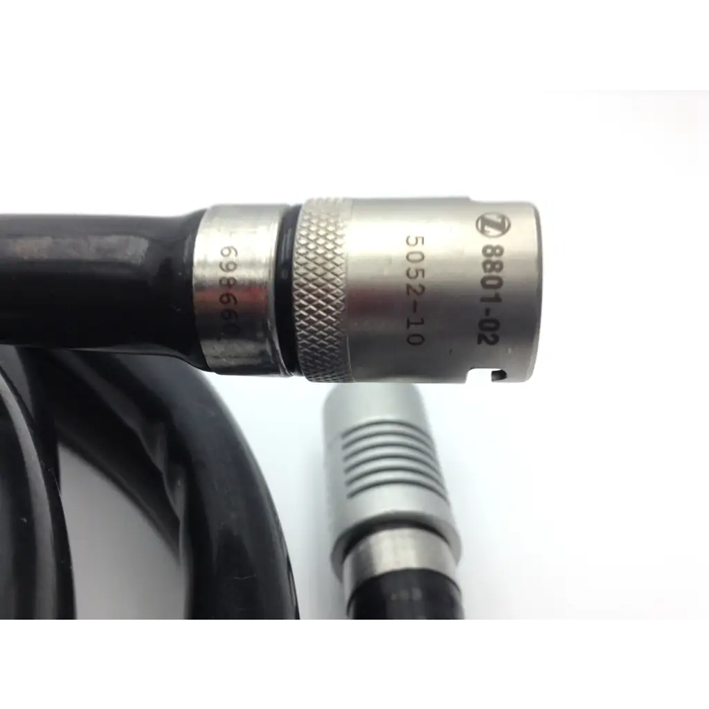 Zimmer hall surgical wire driver metallic connector with textured grip and engraved serial numbers on black cable