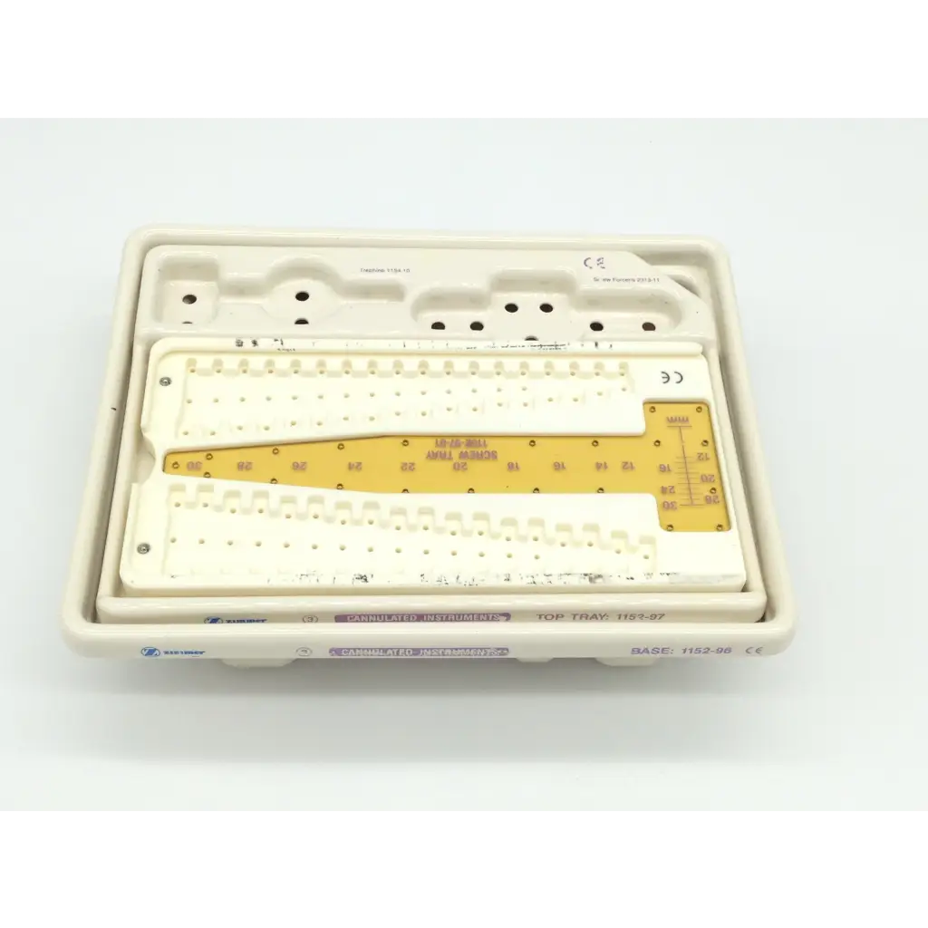 White plastic surgical instrument tray with yellow measurement scale for zimmer herbert whipple orthopedic bone screw system