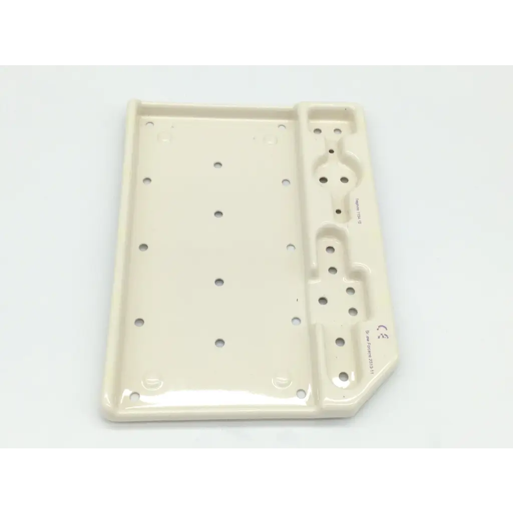 Cream-colored ceramic tray with glossy finish and circular indentations for zimmer herbert whipple orthopedic bone screw system