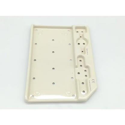 Cream-colored ceramic tray with glossy finish and circular indentations for zimmer herbert whipple orthopedic bone screw system